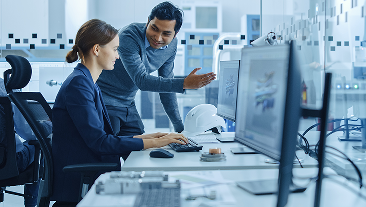 Employees collaborating at desk