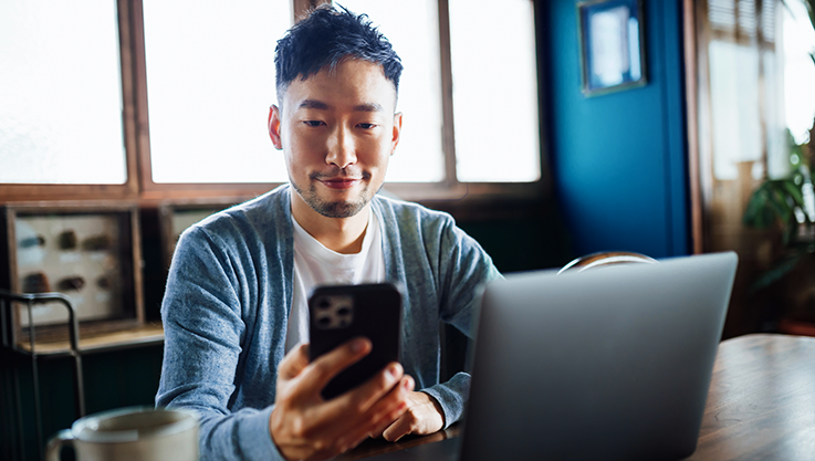 Man looking at expenses on his phone